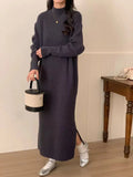 Acrylic knitted half turtleneck dress in beige colour with long sleeves and high waist midi skirt.