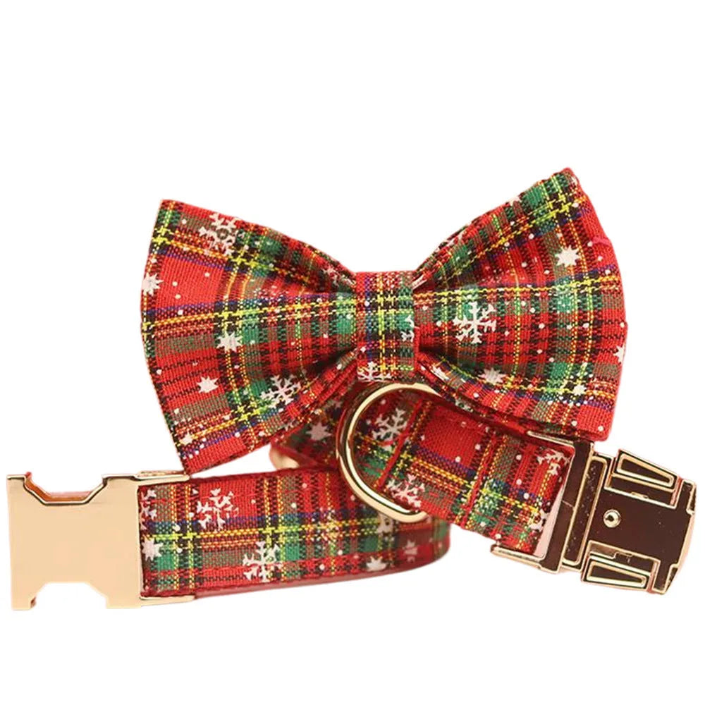 Red background snowflake plaid Christmas pet collar leash set with bowknot flowers and dog vest on a small dog