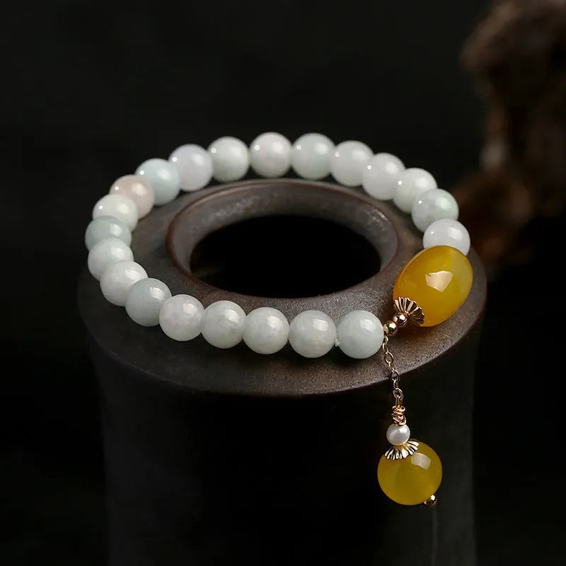 Women's bracelet with 7.5mm round agate beads and hanging tassel in 14K gilded finish