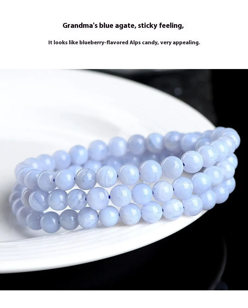 Blue agate multi-circle pattern bead bracelet with original design on a wrist
