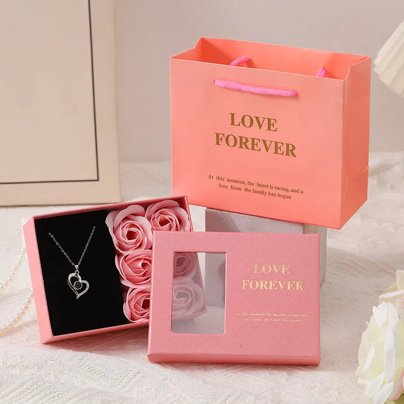 Korean style gift box with six red soap roses and a matching handbag for Valentine's Day.