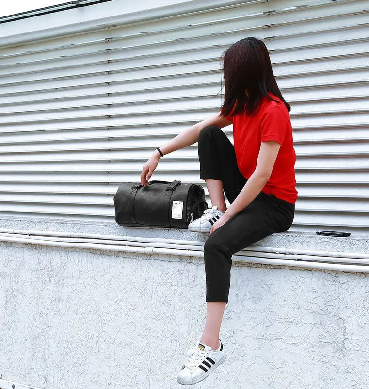 Black waterproof sports bag with separate shoe compartments shown in Large and Small sizes.