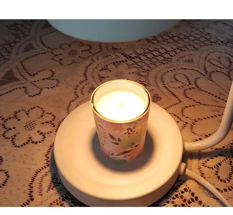 White European-style metal aromatherapy wax lamp with a dimmer switch on a table.