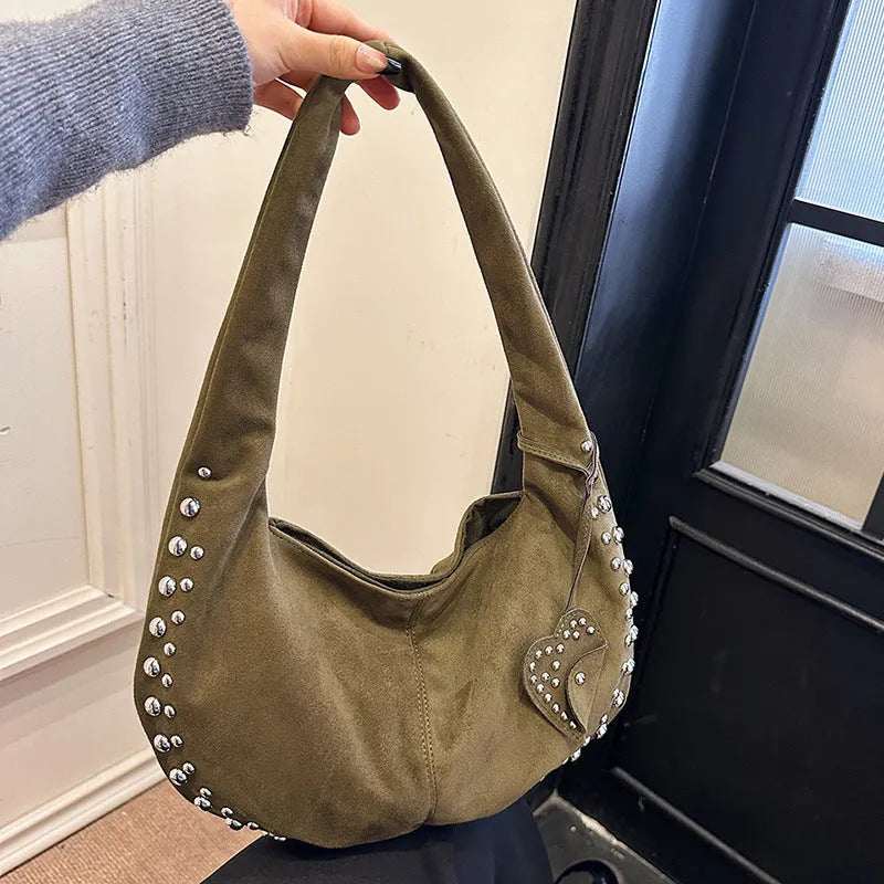 Soft plush underarm tote handbag for women in a strapless retro design, shown in multiple colour options.