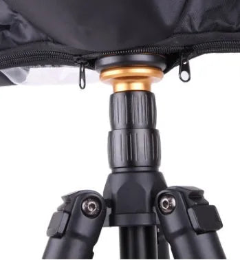 Single lens reflex camera with long focus lens fitted with rainproof cover for outdoor protection
