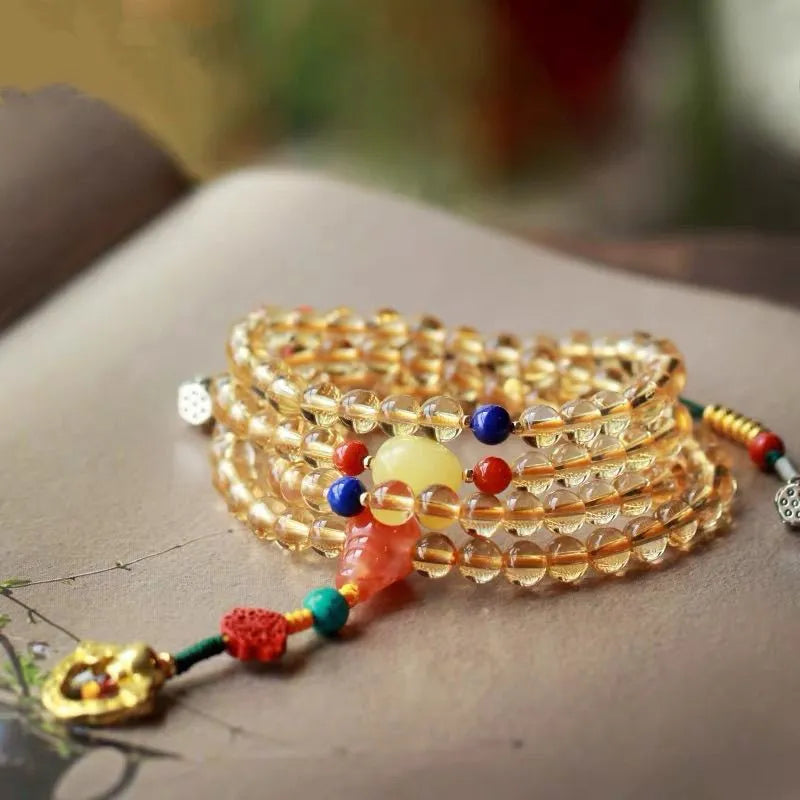 Natural citrine bracelet with red and yellow 1mm beads on filament string in light luxury style