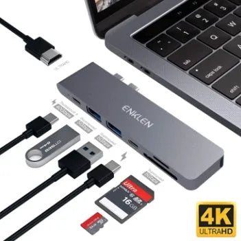 Compact silver USB-C multi-port adapter with SD card slot, HDMI, USB ports, and Thunderbolt 3 connector