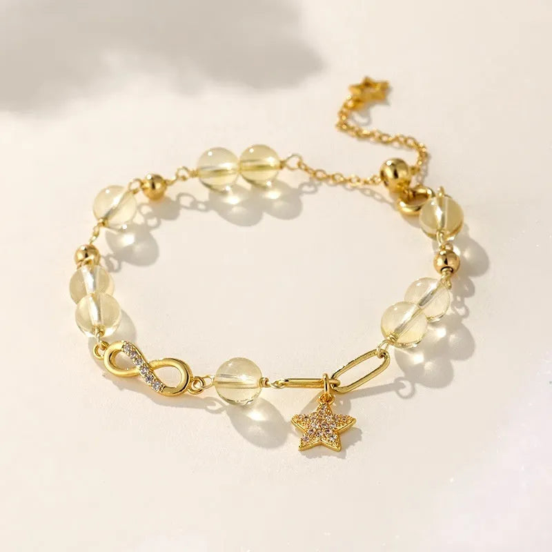 Natural gray moonstone Mobius crystal bracelet with polished finish on women's wrist