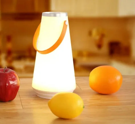 White LED rechargeable night light on a bedside table, 12x12x22cm ABS plastic body with warm glow