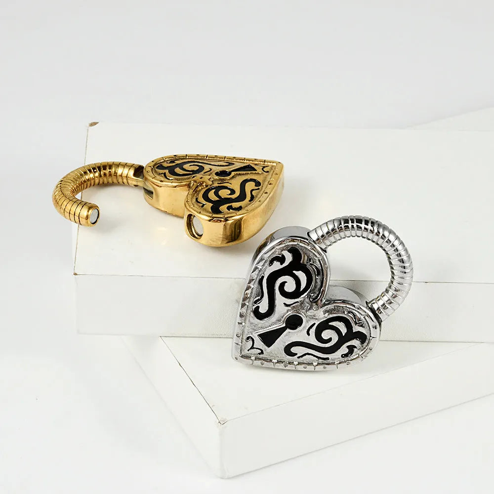 Close-up of a women's stainless steel heart-shaped earring with an electroplated gold colour finish.
