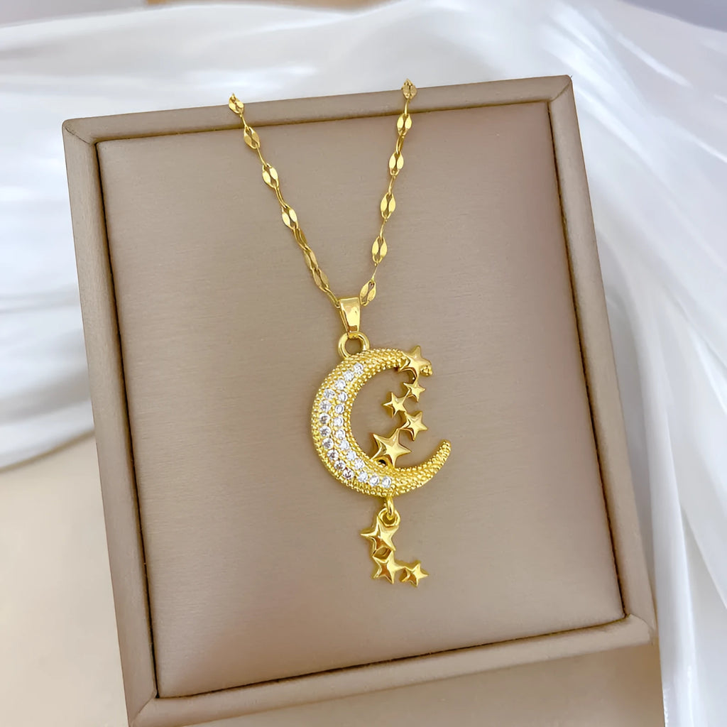 Geometric moon pendant necklace with tassel detailing in stainless steel and copper construction