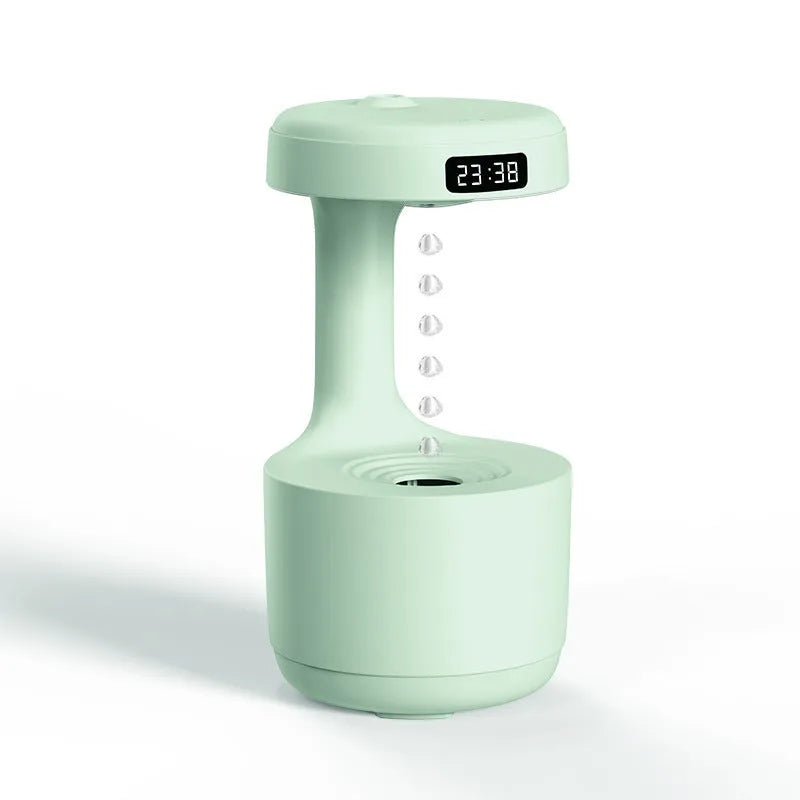 Anti gravity levitating water drops humidifier with LED night light, rose gold white, on desk