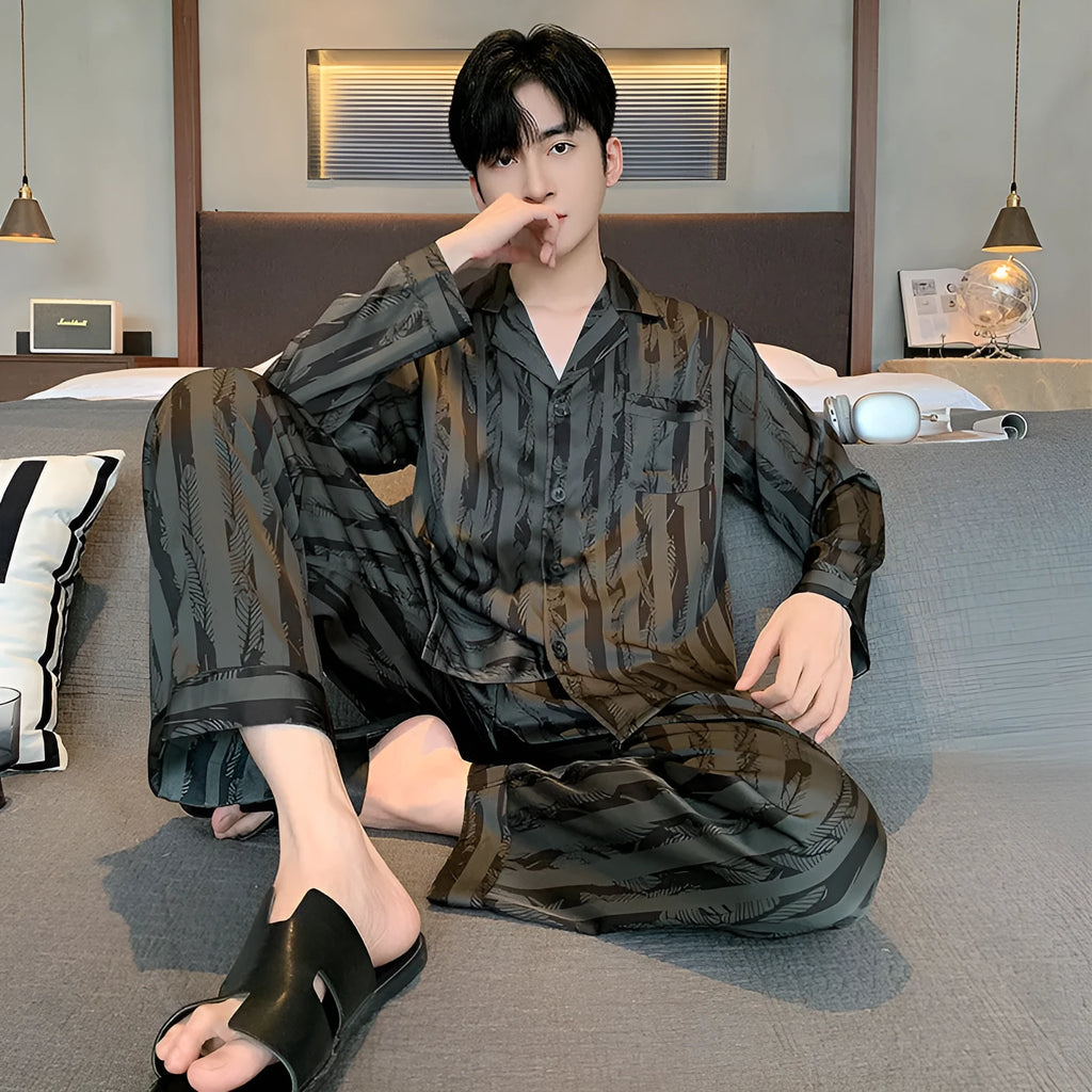 High-grade ice silk men's pyjama set V-neck long sleeve top and thin trousers in black stripes on a neutral background