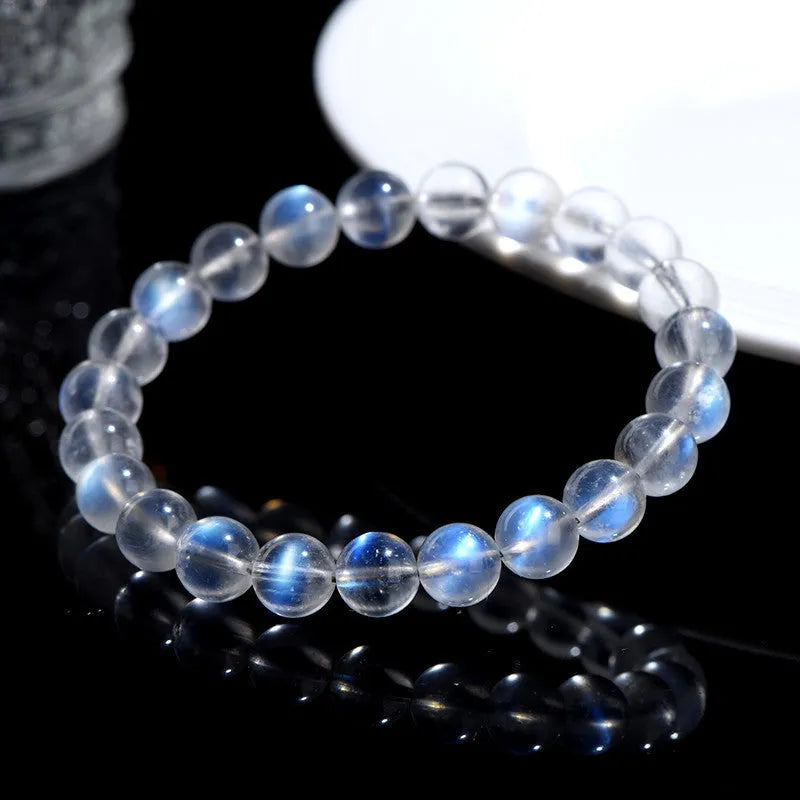 Natural cream body crystal blue moonlight bracelet showing polished finish on a simple band.