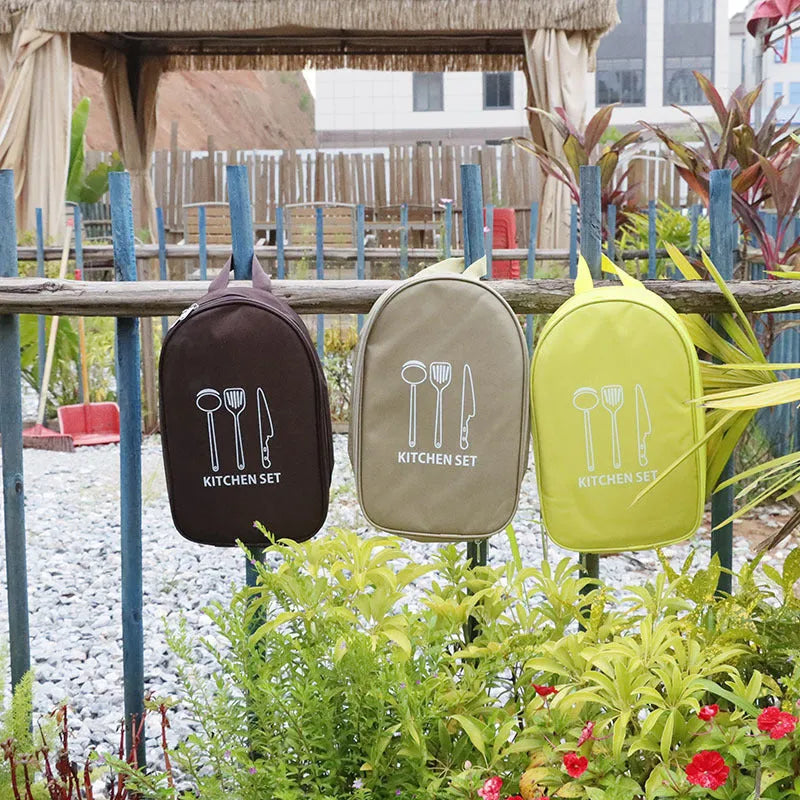 Khaki storage bag containing 12 pieces of stainless steel picnic cutlery including knives, forks and spoons.