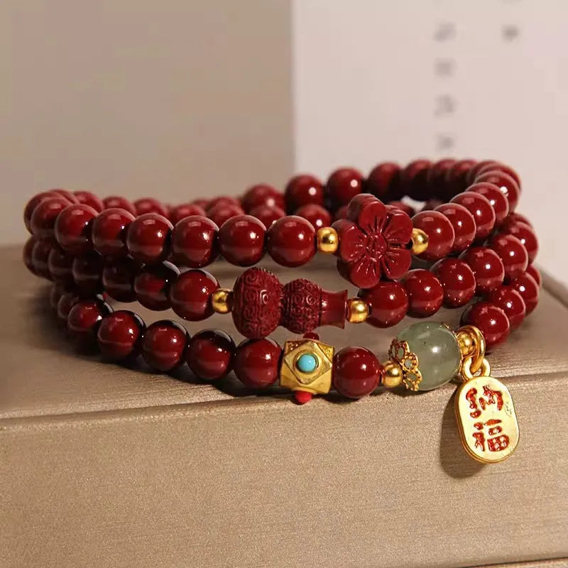 Multi-circle cinnabar bracelet with gourd and five petal flower motifs, polished finish, 6mm beads