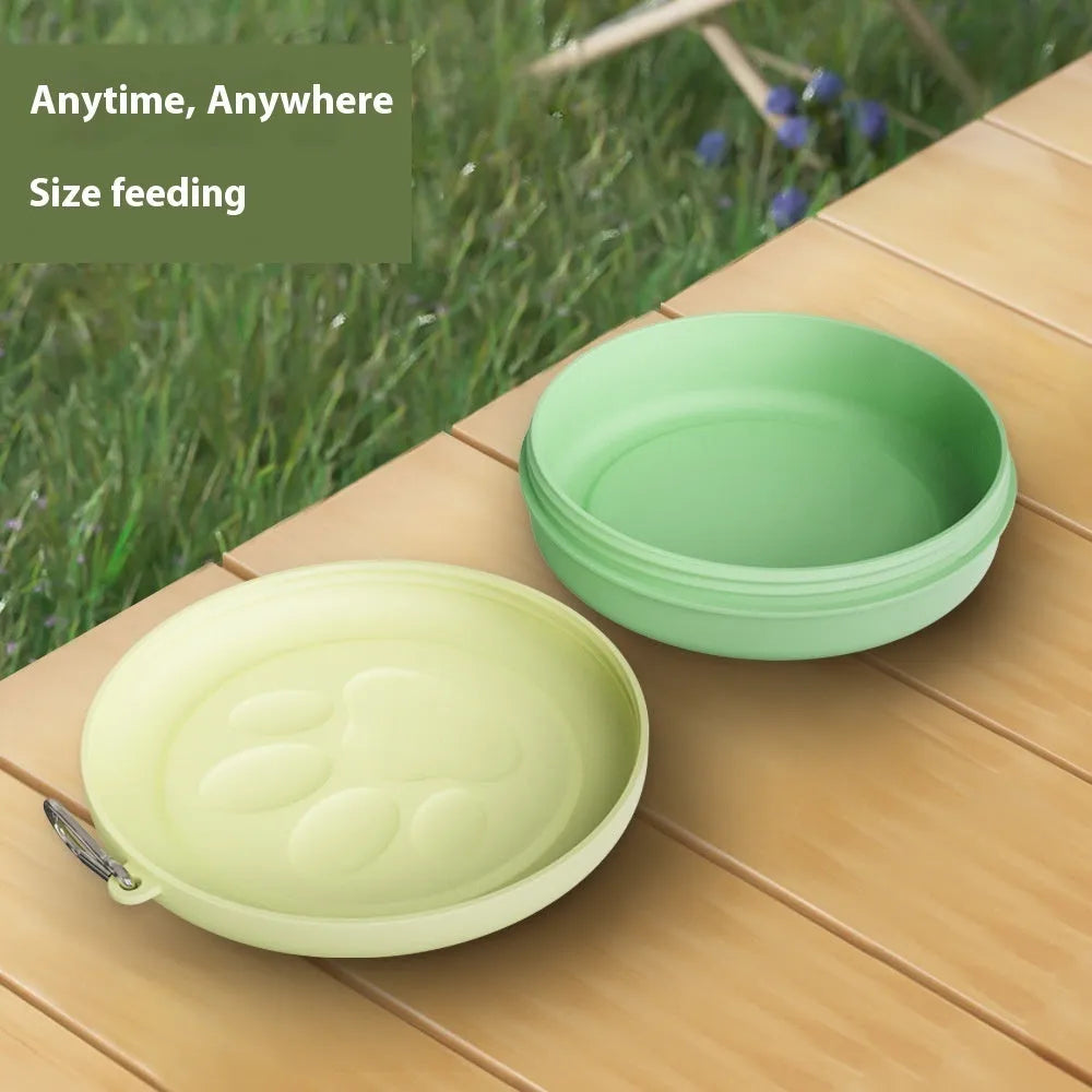 Collapsible portable dog food and water bowl with separate lid, shown in light green.