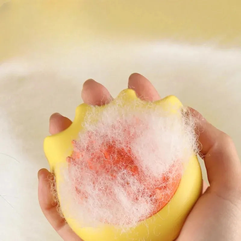 Pet bath brush with built-in shampoo box showing blue, orange and yellow colour options