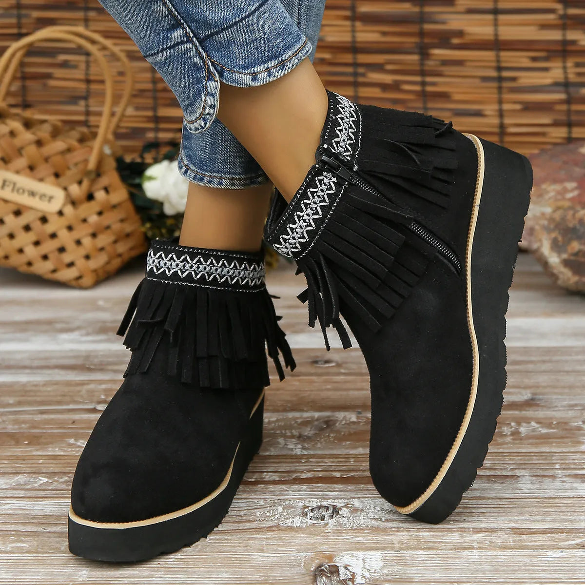 Women's suede wedge booties with side zipper, thick rubber sole, and tassel detail in black colour