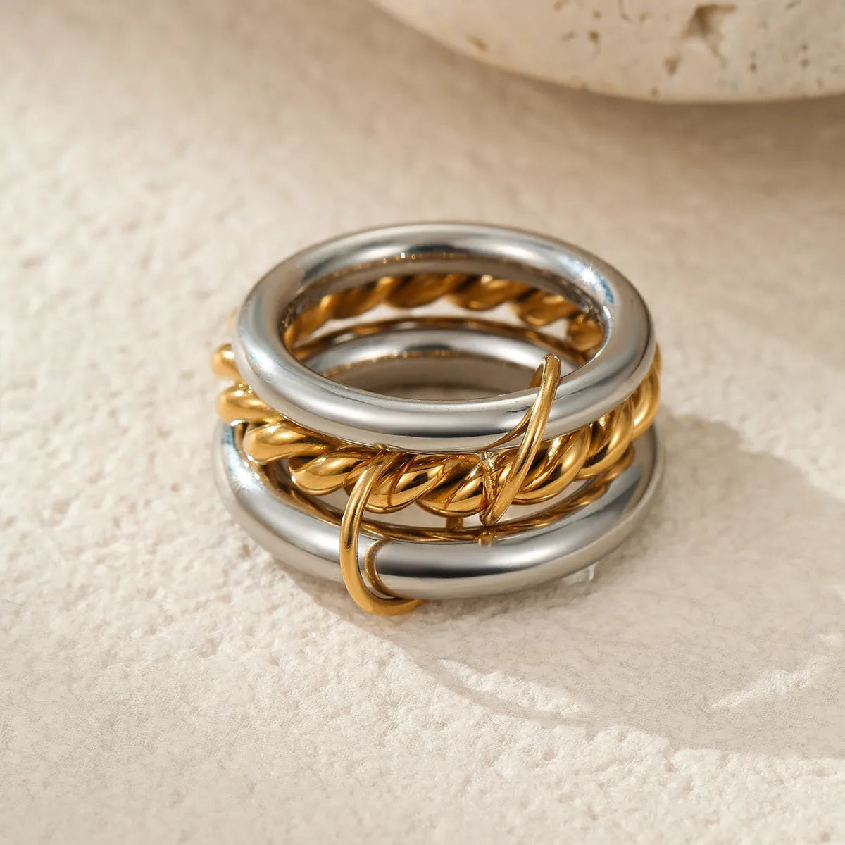 Stacked stainless steel rings with 18K gold plating in colour matching design