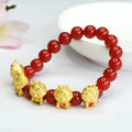 Red agate bracelet with detailed dragon carving on an 8mm bead.