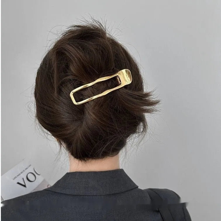 Women's zinc alloy hair barrette in gold polished finish showing square shape design