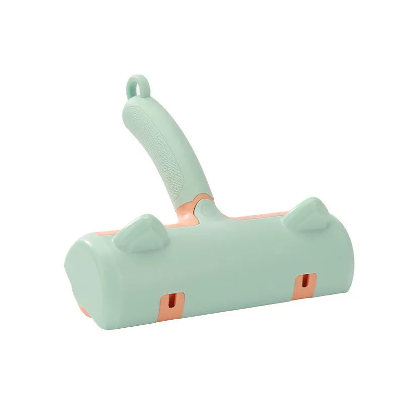 Mint green cat hair removal brush with ear style design on a light background