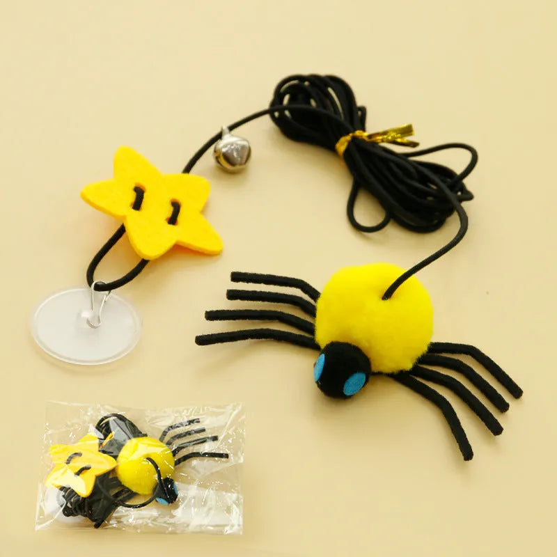 Red cat hanging toy with feather stick and bell spider on elastic rope mounted to door