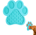 Blue bone-shaped silicone dog licking mat with suction cups on a shower tile.