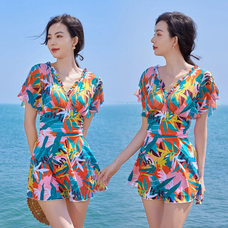 Colourful printed one-piece swimsuit for women available in sizes M to 3XL with belly coverage