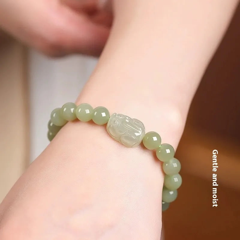 Women's Hetian jade leather show bracelet in national style, polished finish, 8mm bead size on neutral background