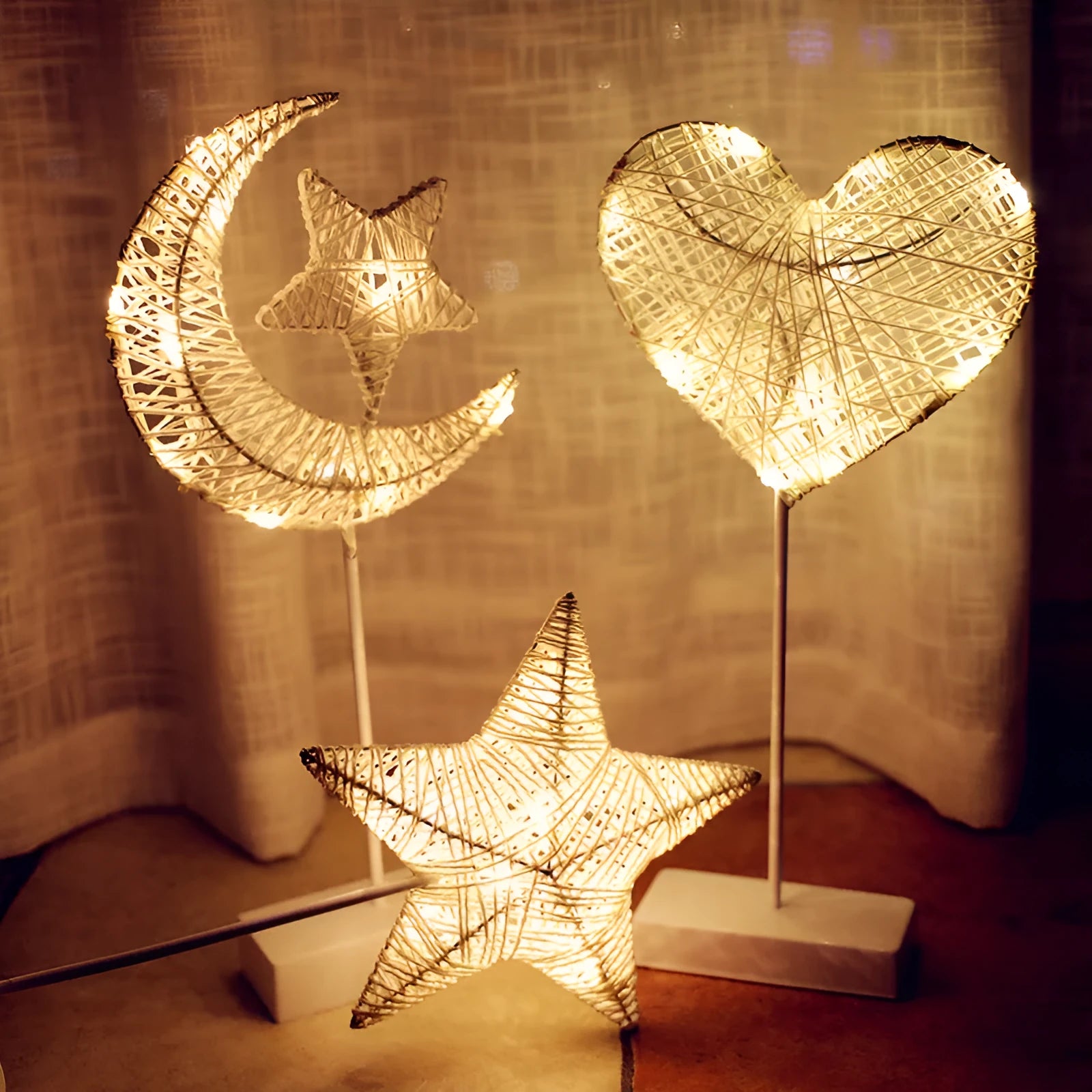 Rattan LED decorative light set showing star, heart and moon designs with copper wire details