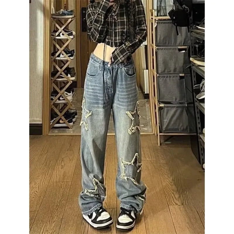Blue high-waist women's jeans with a wide-leg straight cut on a mannequin.