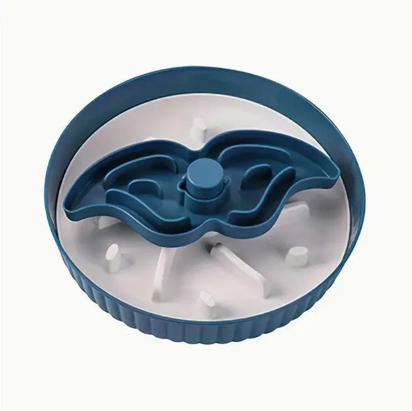 Rotating plastic pet slow feeder bowl with silicone anti-choke mat in windmill pattern.