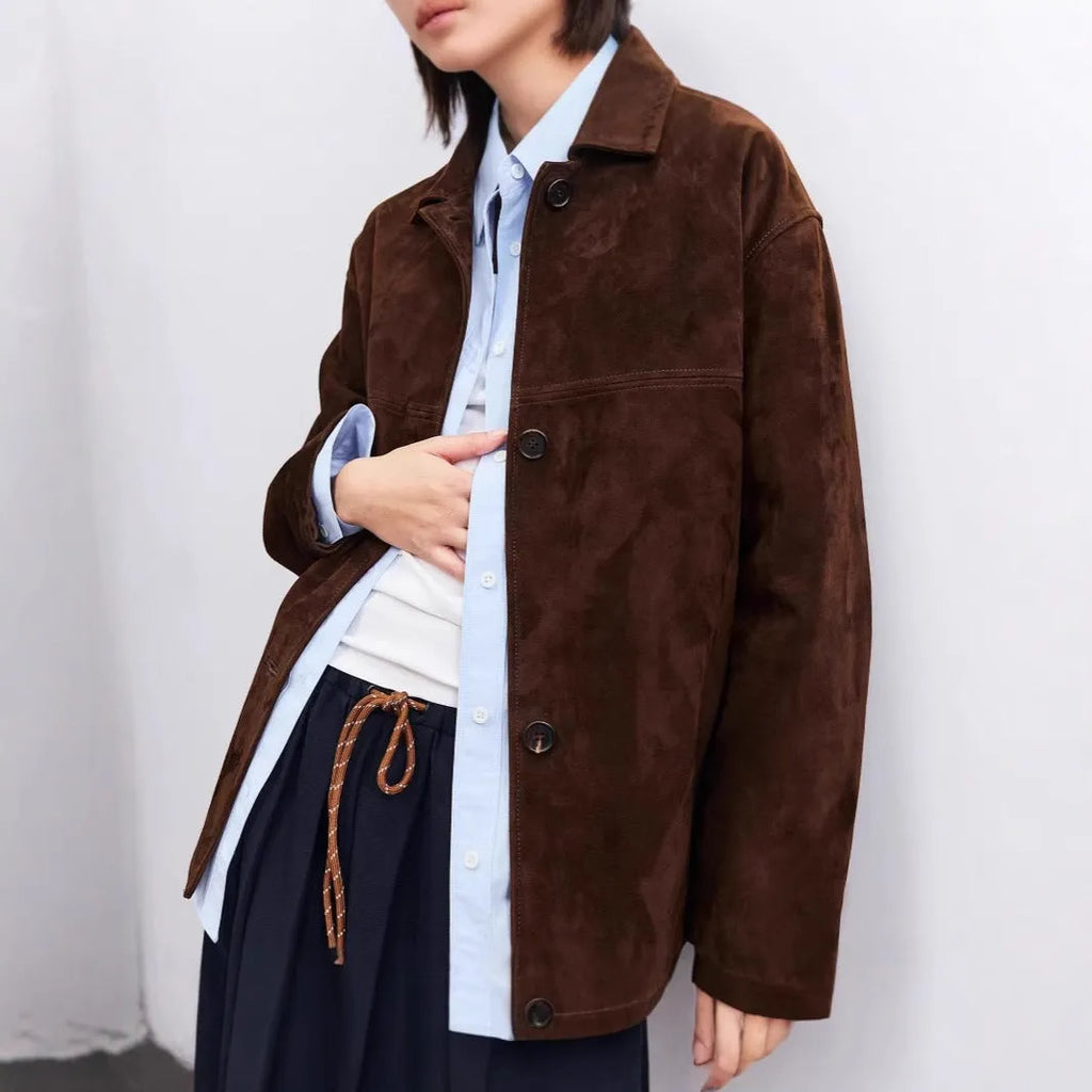 Yellow brown retro cashmere coat with Peter Pan collar, belt, and leather stitching detail.