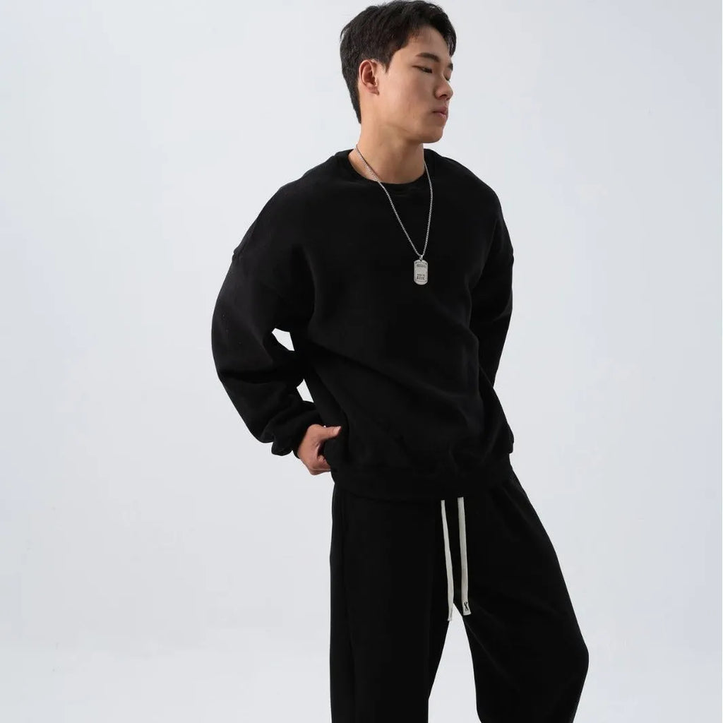 Men's loose fit polar fleece sports suit in winter colours, showing coat and trousers.