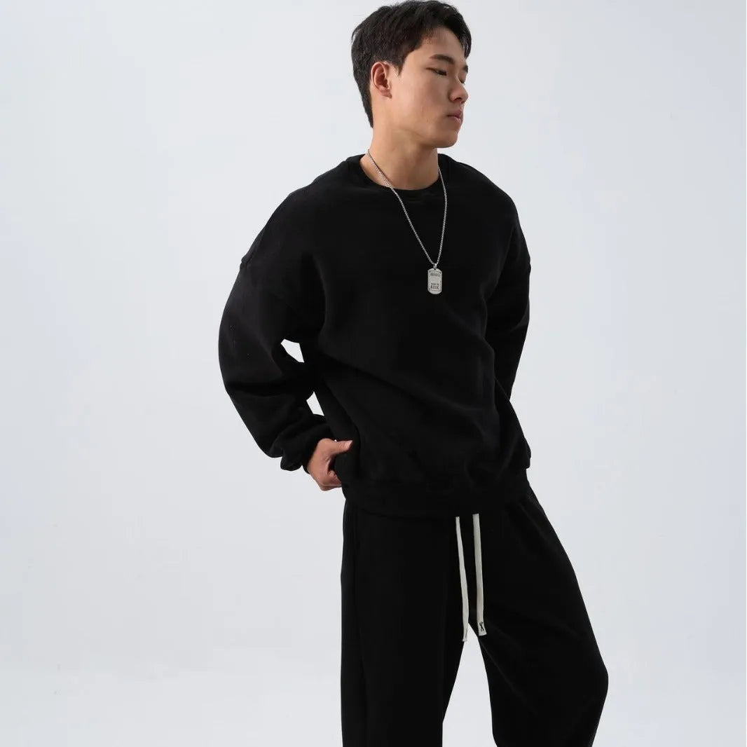 Men's loose fit polar fleece sports suit in winter colours, showing coat and trousers.