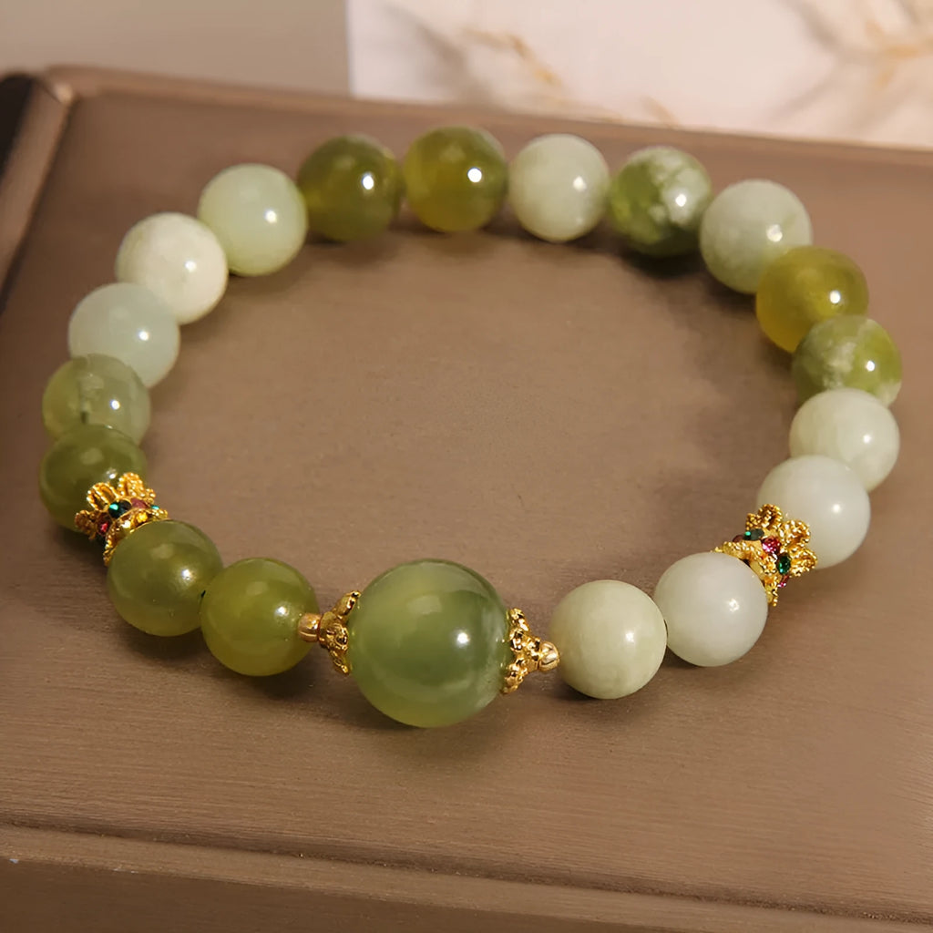 Women's bracelet in Xiuyan jade green with original design on display