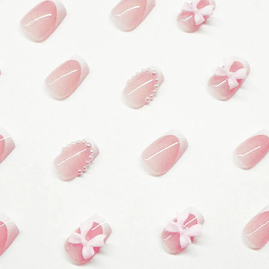 French manicure false nails with white bow design on short square nails with S274 adhesive glue