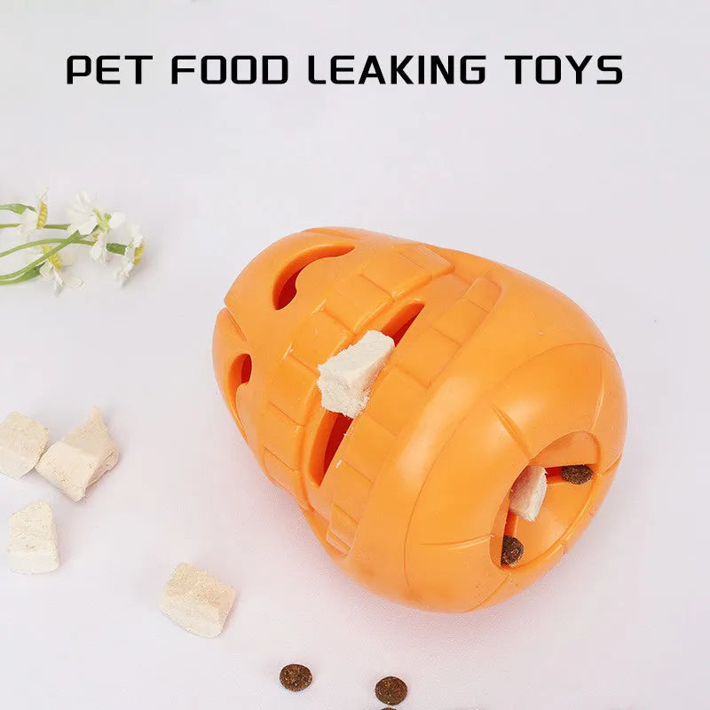 Orange Halloween pumpkin-shaped dog chew toy with a treat-dispensing funnel opening.