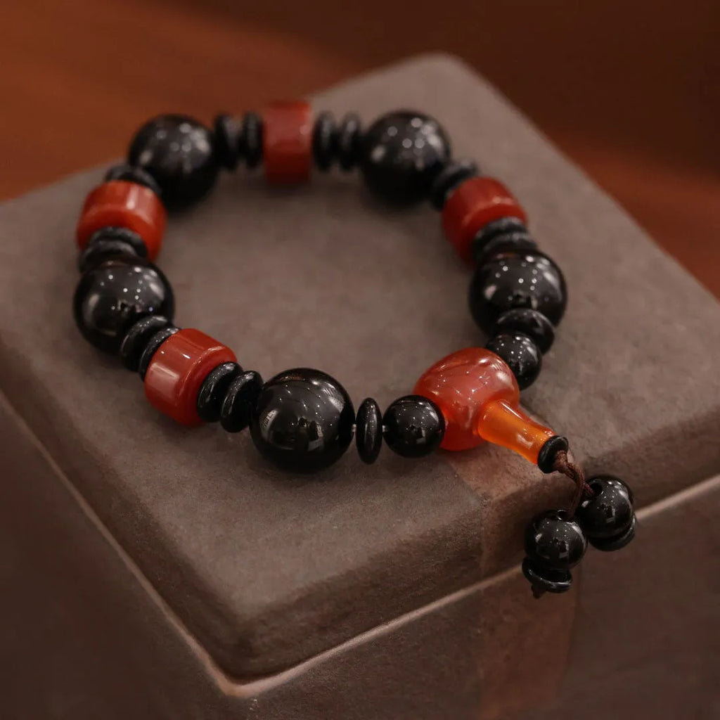 Natural twining line old agate bracelet with sardonyx agate abacus beads and white and red agate spacer beads on neutral background