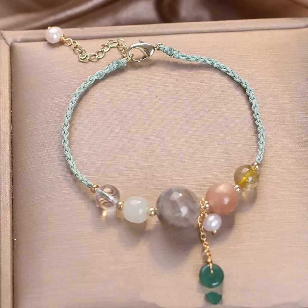 Hand-woven peace buckle bracelet with crystal and sequin details in red, green, and blue colour options for women