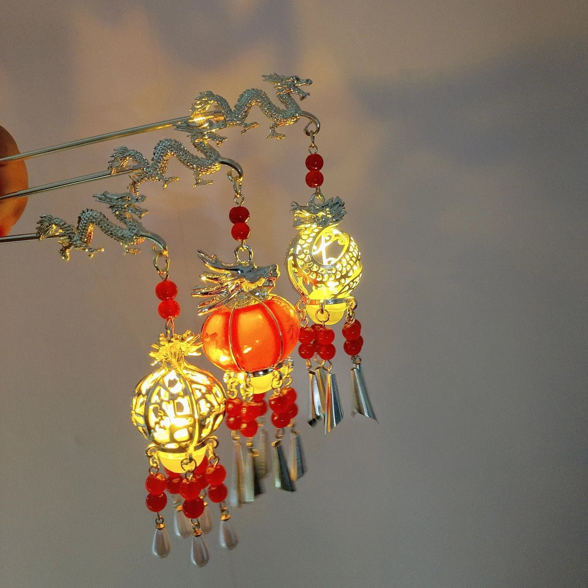 Dragon year luminous lantern hairpin with pearl finish and retro geometric design