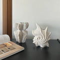 European retro style ceramic vase with a coloured glaze finish on a wooden surface.