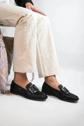 Low-cut black loafers for women with large square button and rhinestone details, round toe, low heel