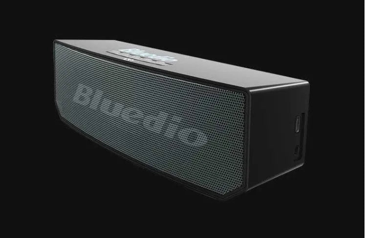 Black rectangular Bluetooth speaker with grille front showing 52mm drivers