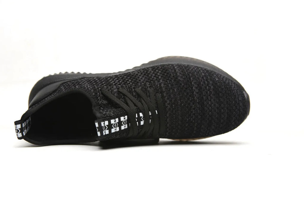 Safety work shoes with steel toe caps in black, grey, and dark green colours for industrial and outdoor use