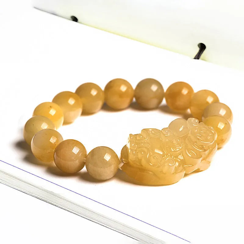 Carved Jinsi Jade money bracelet in golden thread jade colour showing large and small size options.