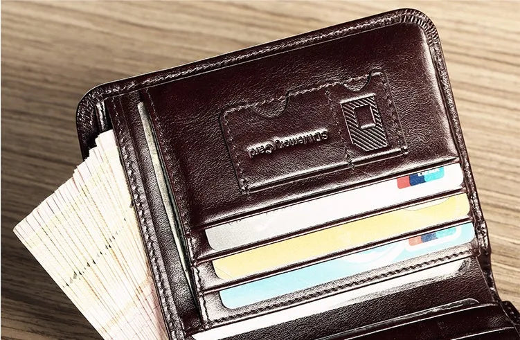 Men's black leather wallet open to show internal compartments for banknotes, cards, coins, and a concealed dark space.
