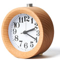 Solid beech wood silent snooze alarm clock showing wooden case and white dial.